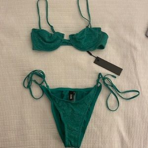 Triangl green sparkly swimsuit never worn. Both size XS.